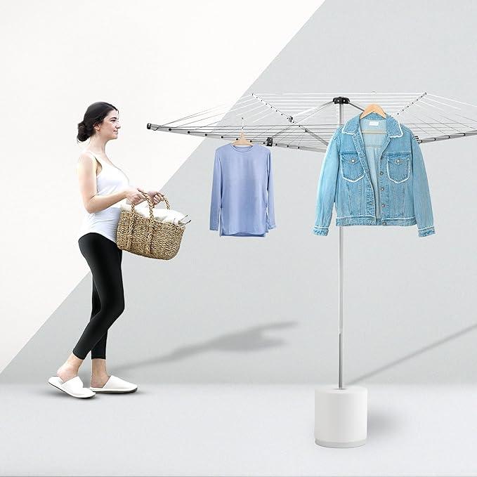 Woman with woven basket using modern outdoor rotary clothes drying rack holding blue shirt and denim jacket